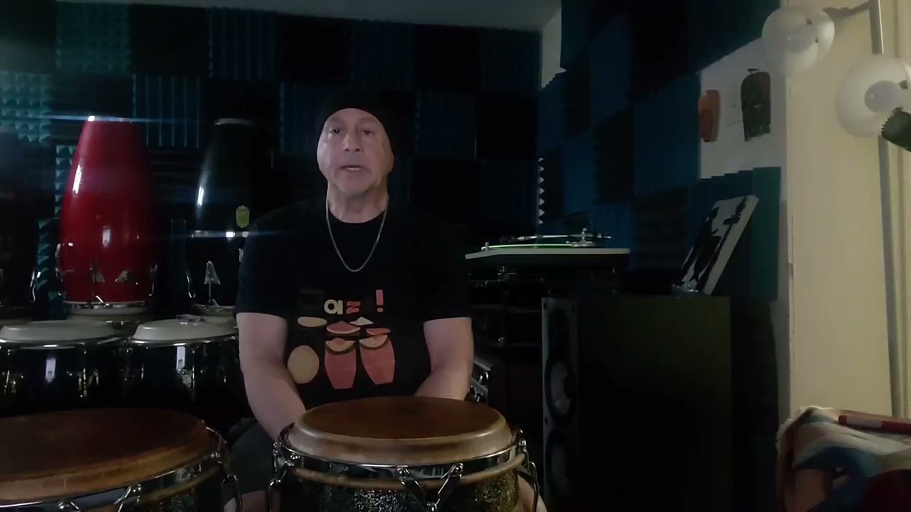 Daniel Sadownick surrounded by congas and studio gear